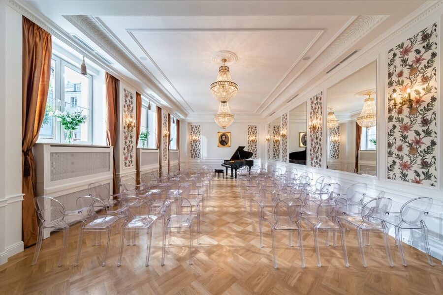 Warsaw: Chopin Concert Ticket With Glass of Champagne - The champagne break and Chopin stories: how the host shapes the night